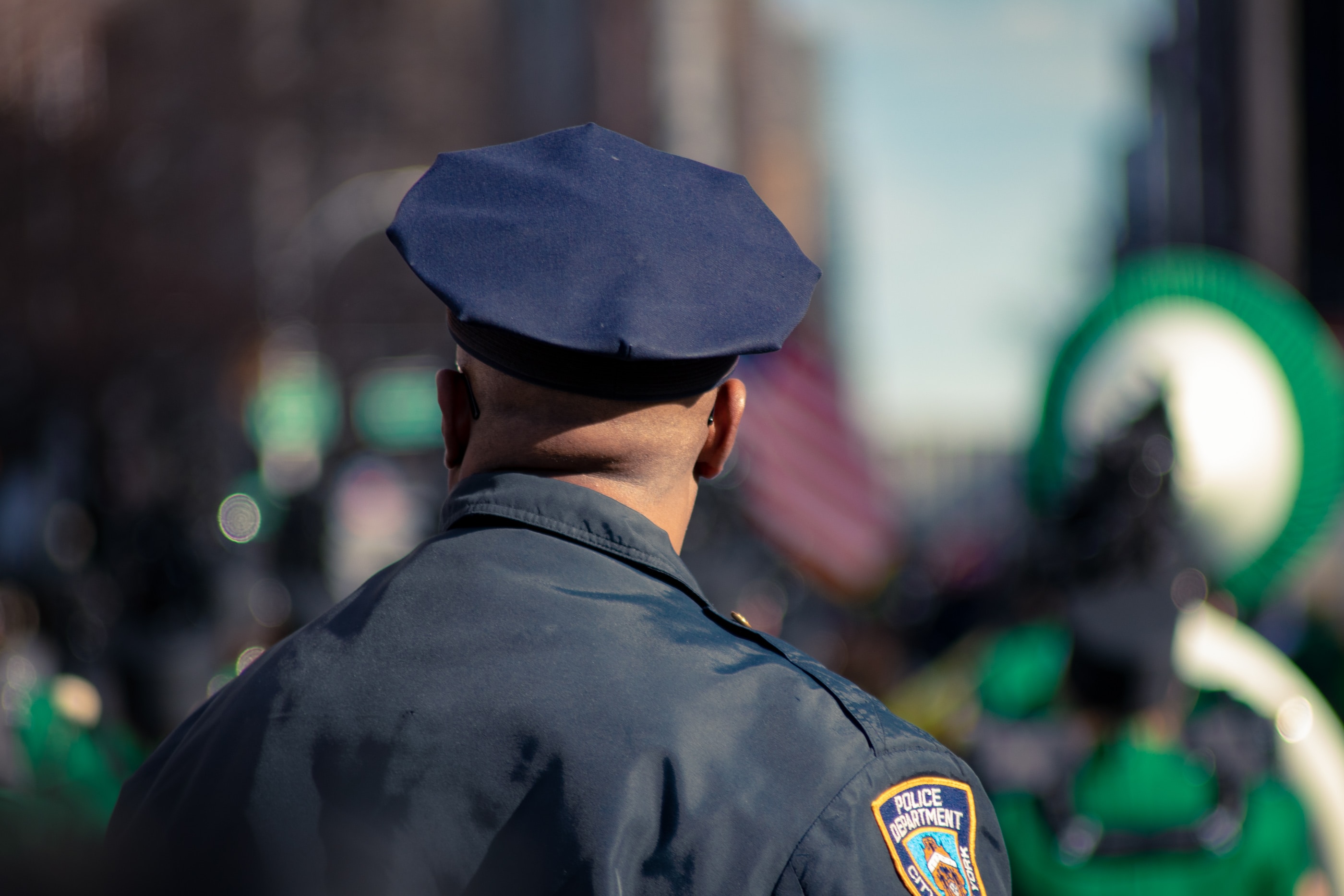 Police officer helping a business assess their private security needs